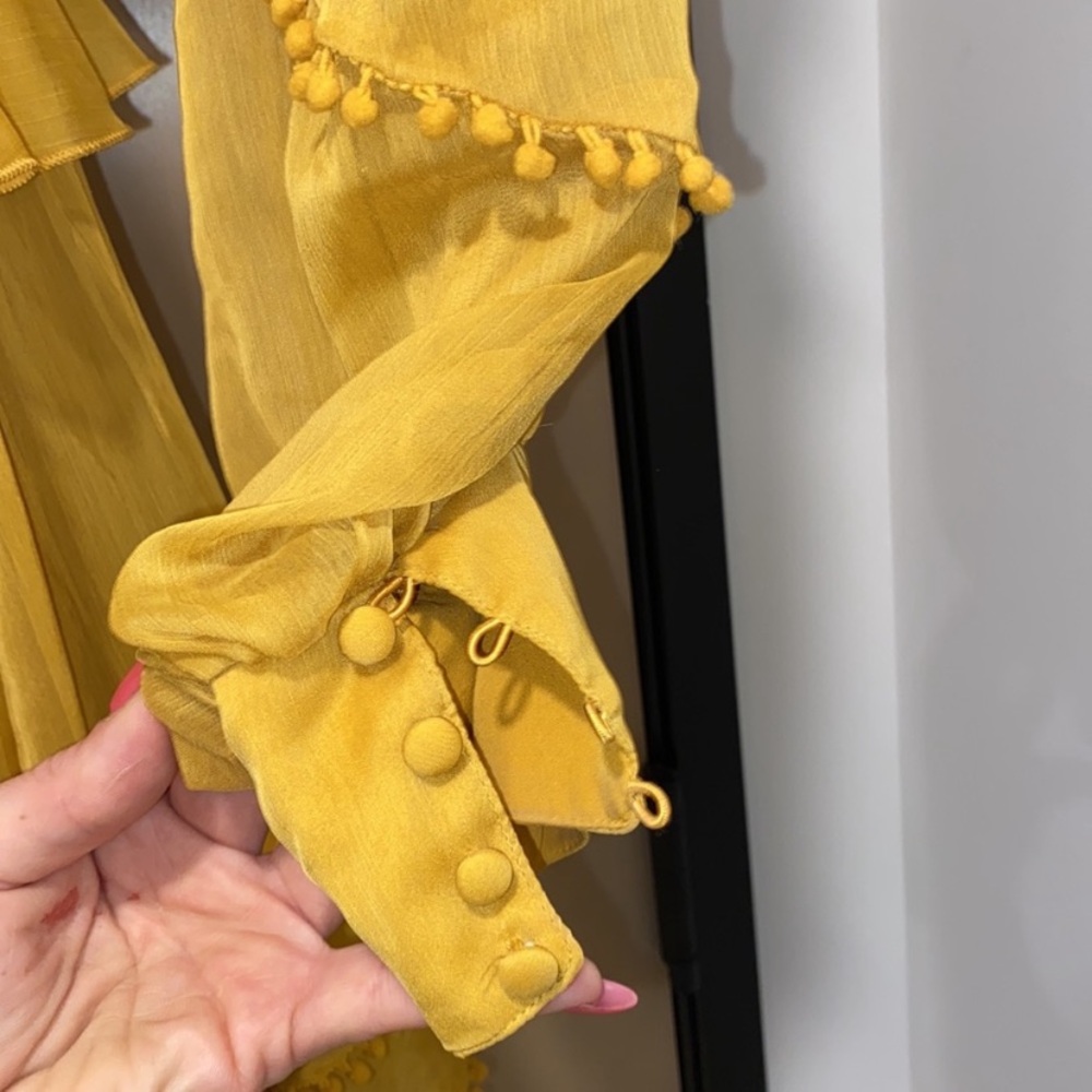 Beautiful mustard dress with tassel detailing and open cut style on sides - Picture 5 of 6